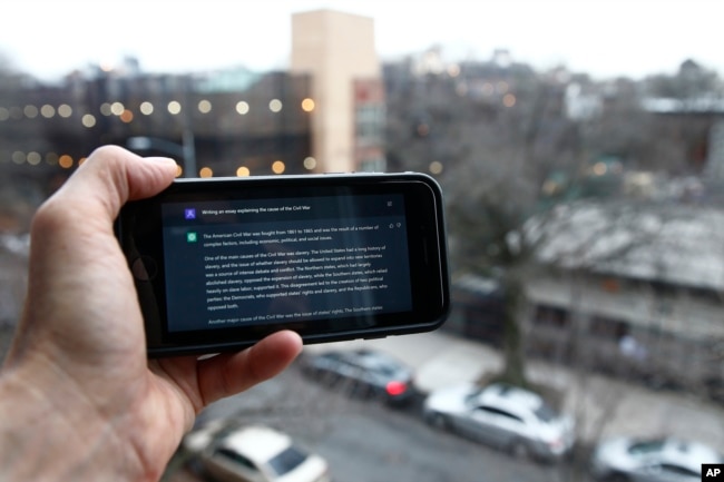 FILE - A ChatGPT prompt is shown on a device near a public school in Brooklyn, New York, Thursday, Jan. 5, 2023. (AP Photo/Peter Morgan)