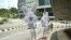 Animal rights activists dressed up as rabbits carry signs that read "Ajinomoto Stop Animal Tests" as they protest outside Ajinomoto headquarters in Kuala Lumpur.