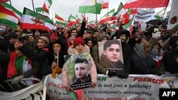 People take part in a rally against the Iranian regime in front of the European Parliament in Strasbourg, eastern France, on Jan. 16, 2023.