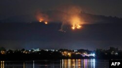 A forest fire nears the town of Chiguayante, in the province of Concepcion, Chile.&nbsp;More than 5,600 local firefighters, with backup from Mexico, Colombia and Spain, were actively battling 89 fires out of a total of 311 burning a week into the disaster, officials said.