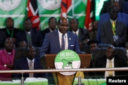 FILE - Independent Electoral and Boundaries Commission (IEBC) chairman Wafula Chebukati announces the result in Kenya's presidential election at the IEBC National Tallying Center at the Bomas of Kenya, in Nairobi, Aug. 15, 2022.