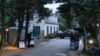 FILE - The access road to President Joe Biden's home in Wilmington, Del., is seen from the media van on Jan. 13, 2023. 