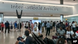 FILE - Travelers at London's Heathrow Airport, July 13, 2022. Global airline traffic was up from pandemic levels in 2022 and is expected to continue to grow. 