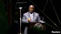 FILE: South African President Cyril Ramaphosa delivers the keynote address at the Investing in African Mining Indaba 2023 conference in Cape Town, Feb. 7, 2023.