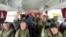 A still image from video released on Feb. 4, 2023, by Russia's Defense Ministry, shows who it said are captured Russian service personnel in a bus following an exchange of prisoners of war at an unknown location in the course of Russia-Ukraine conflict.
