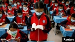 Students attend a Tibetan composition class at Duilongdeqing District high school in Lhasa, during a government-organized tour of the Tibet Autonomous Region, China, October 16, 2020.(REUTERS/Thomas Peter)