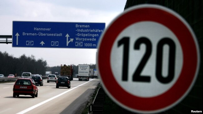FILE - Cars pass a 120 km/h (75 mph) speed limit sign on the A27 Autobahn near Bremen, Germany, April 10, 2008. A study published in January 2023 found that Germany could save almost three times more carbon dioxide emissions than previously thought with a speed limit on highways.