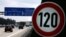 FILE - Cars pass a 120 km/h (75 mph) speed limit sign on the A27 Autobahn near Bremen, Germany, April 10, 2008. A study published in January 2023 found that Germany could save almost three times more carbon dioxide emissions than previously thought with a speed limit on highways.