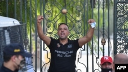 FILE - Seifeddine Makhlouf, head of Islamist nationalist party Al-Karama, gestures outside Parliament in Tunis, Tunisia, on July 26, 2021, after the president suspended Parliament and dismissed the Prime Minister. Police detained him on Jan. 21, 2023, said his lawyer.