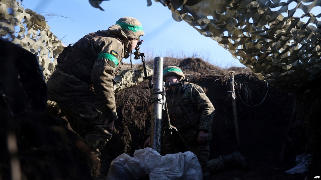 A Ukrainian serviceman gets ready to fire with a mortar from a position not far from Bakhmut, Donetsk region on Jan. 27, 2023, amid Russian invasion of Ukraine. 