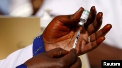 FILE: A health worker prepares a dose of the coronavirus disease (COVID-19) vaccine in Dakar, Senegal. taken Feb.23, 2021