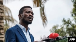 FILE: Robert Kyagulanyi, former presidential caqndidagte and musician known as "Bobi Wine," holding a news conference. Taken Jan. 15, 2021