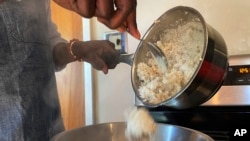 Pierre Thiam, executive chef and co-founder of New York-based fine-casual food chain Teranga, cooks fonio, a variety of millet, in El Cerrito, Califrnia, Jan. 27, 2023.