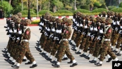 FILE - Members of the Myanmar military march during a parade to commemorate Myanmar's 77th Armed Forces Day in Naypyitaw, Myanmar, March 27, 2022. 