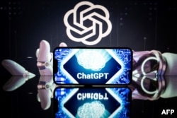 FILE - An illustration photo taken Jan. 23, 2023, shows screens displaying the logos of OpenAI and ChatGPT.