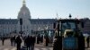 French farmers gather with their tractors near the Invalides during a protest over pesticide restrictions and other environmental regulations, in Paris, Feb. 8, 2023.