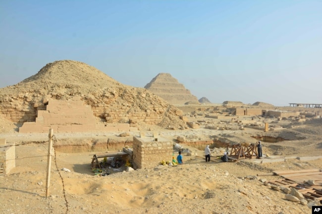 This photo provided by the Saqqara Saite Tombs Project in January 2023 shows an excavation area overlooking the pyramid of Unas and the step pyramid of Djoser in Saqqara, Egypt. (Susanne Beck/Saqqara Saite Tombs Project, University of Tübingen via AP)