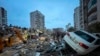 Emergency teams search for people in a destroyed building in Adana, Turkey, Feb. 6, 2023. 