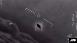 FILE — This video grab image obtained April 28, 2020 courtesy of the U.S. Department of Defense shows part of an unclassified video taken by Navy pilots that have circulated for years showing interactions with ‘unidentified aerial phenomena.’