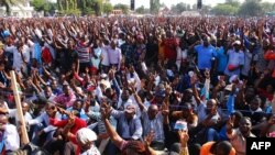 Supporters of Tanzania's main opposition party Chadema gesture during the party's first political rally after an imposed ban from 2016 was lifted, at Furahisha Grounds in Mwanza, Jan. 21, 2023. 