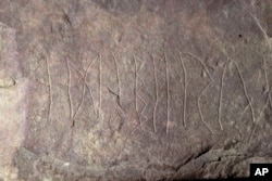 The runestone found at Tyrifjorden, Norway, is shown at the Museum of Cultural History in Oslo, Thursday, Jan. 12, 2023. (Javad Parsa/NTB Scanpix via AP)