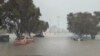 This screen grab from a social media video shows water flooding a street during heavy rainfall in Auckland, New Zealand, Jan. 27, 2023. (Courtesy of @MonteChristoNZ via Reuters)