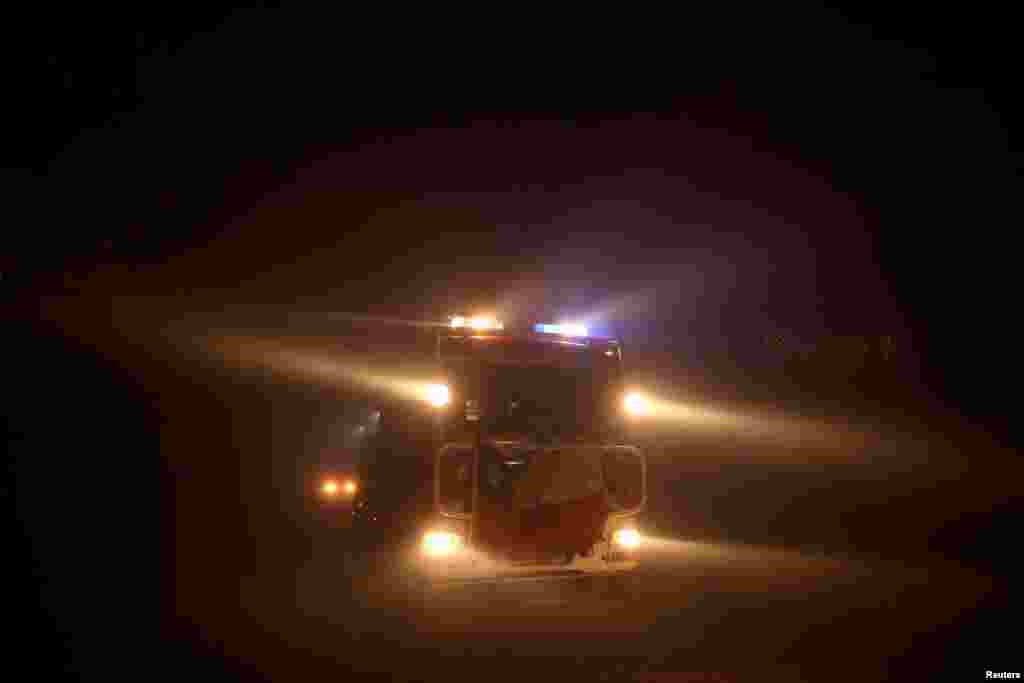 A firefighter truck responds to a wildfire in Quillon, Chile, Feb. 7, 2023. 