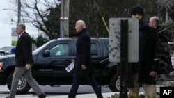 President Joe Biden walks from St. Edmund Roman Catholic Church after attending Mass in Rehoboth Beach, Del., Jan. 21, 2023. 