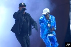 Chuck D, left, and Flavor Flav perform "Rebel Without a Pause" at the 65th annual Grammy Awards on Sunday, Feb. 5, 2023, in Los Angeles. (AP Photo/Chris Pizzello)