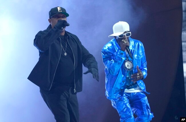 Chuck D, left, and Flavor Flav perform "Rebel Without a Pause" at the 65th annual Grammy Awards on Sunday, Feb. 5, 2023, in Los Angeles. (AP Photo/Chris Pizzello)