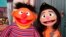 FILE - Ernie, a Muppet from the popular children's series 'Sesame Street,' appears with new character Ji-Young, the first Asian American muppet, on the set of the long-running children's program in New York on Nov. 1, 2021.