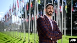 FILE - American basketball player Enes Freedom poses during an interview with AFP at the United Nations Office in Geneva, April 5, 2022. 