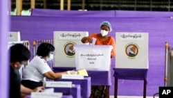 A voter casts ballot at a polling station on Nov. 8, 2020, in Yangon, Myanmar. A court in Myanmar on Friday, Sept. 2, 2022 sentenced the country’s ousted leader Aung San Suu Kyi to three years' imprisonment after finding her guilty of involvement in election fraud.