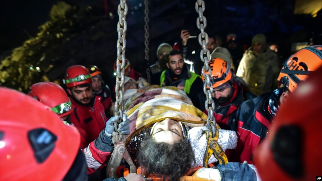 Teams use a crane to rescue Nur Bayraktar in Kahramanmaras, Turkey, Feb. 10, 2023. Emergency crews made a series of dramatic rescues in Turkey on Friday, four days after a catastrophic earthquake killed more than 22,000. 