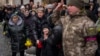 The loved ones of Ukrainian military serviceman Oleg Kunynets cry during his funeral in Lviv, Ukraine, Feb 7, 2023. Germany, Denmark and the Netherlands said Tuesday they plan to send at least 100 older, refurbished Leopard 1 tanks to Ukraine to boost its defense against Russia.