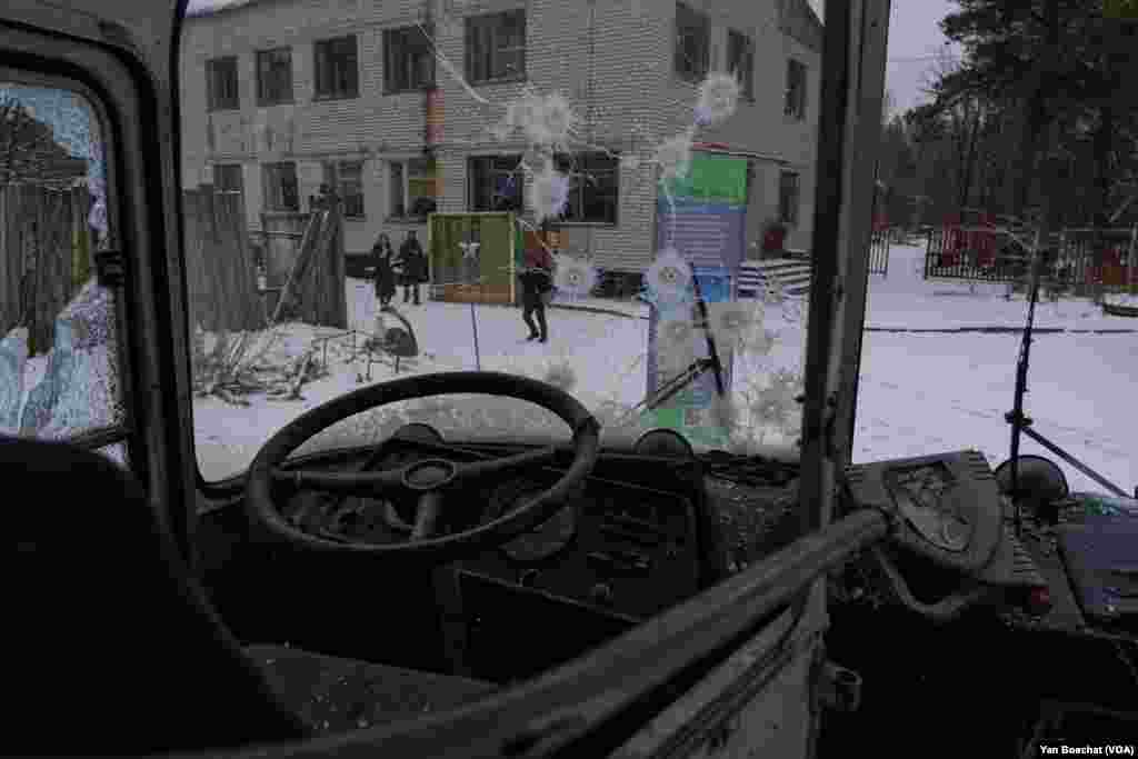 A bus used to take tourists to visit Chernobyl was used as a target of fire by Russian soldiers who occupied the area of the Chernobyl Power Plant, Ukraine, Jan. 31, 2023 (VOANEWS/Yan Boechat)