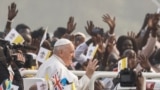 Pope Francis greets people during the Holy Mass at John Garang Mausoleum, during his apostolic journey, in Juba, South Sudan, February 5, 2023