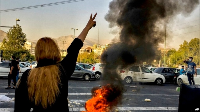 FILE - In this photo taken by an individual not employed by the Associated Press and obtained by the AP outside Iran, Iranians protest the death of Mahsa Amini, 22, after she was detained by the morality police, in Tehran, Oct. 1, 2022.