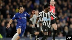 FILE - Chelsea's Pedro, left, and Newcastle United's Christian Atsu, right, vie for the ball during the English Premier League soccer match between Chelsea and Newcastle United at Stamford Bridge stadium in London, Jan. 12, 2019. 