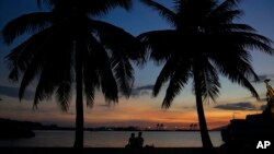 People enjoy the sunset inside what used to be America's largest overseas naval base at the Subic Bay Freeport Zone, Zambales province, northwest of Manila, Philippines on Feb. 6, 2023.