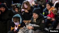 People take shelter inside a metro station during massive Russian missile attacks in Kyiv, Ukraine, Feb. 10, 2023.