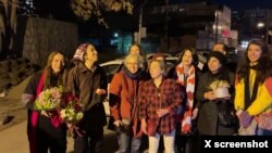 A screenshot from a video posted on the Twitter page of Iranian photographer Alieh Motalebzadeh shows the prisoners whose release from Tehran's Evin prison was announced on Feb. 9, 2023. 