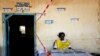 FILE - A South Sudanese election official waits for voters to cast their vote in Juba, South Sudan, Jan. 13, 2011. 