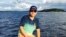 資料照：2015年8月23日，美籍華人李凱在紐約州長島海灣釣魚。中國當局自2016年一直拘押李凱。