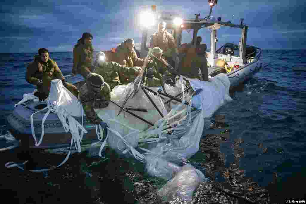 Sailors assigned to Explosive Ordnance Disposal Group 2 recover a high-altitude Chinese surveillance balloon off the coast of Myrtle Beach, South Carolina, Feb. 5, 2023.