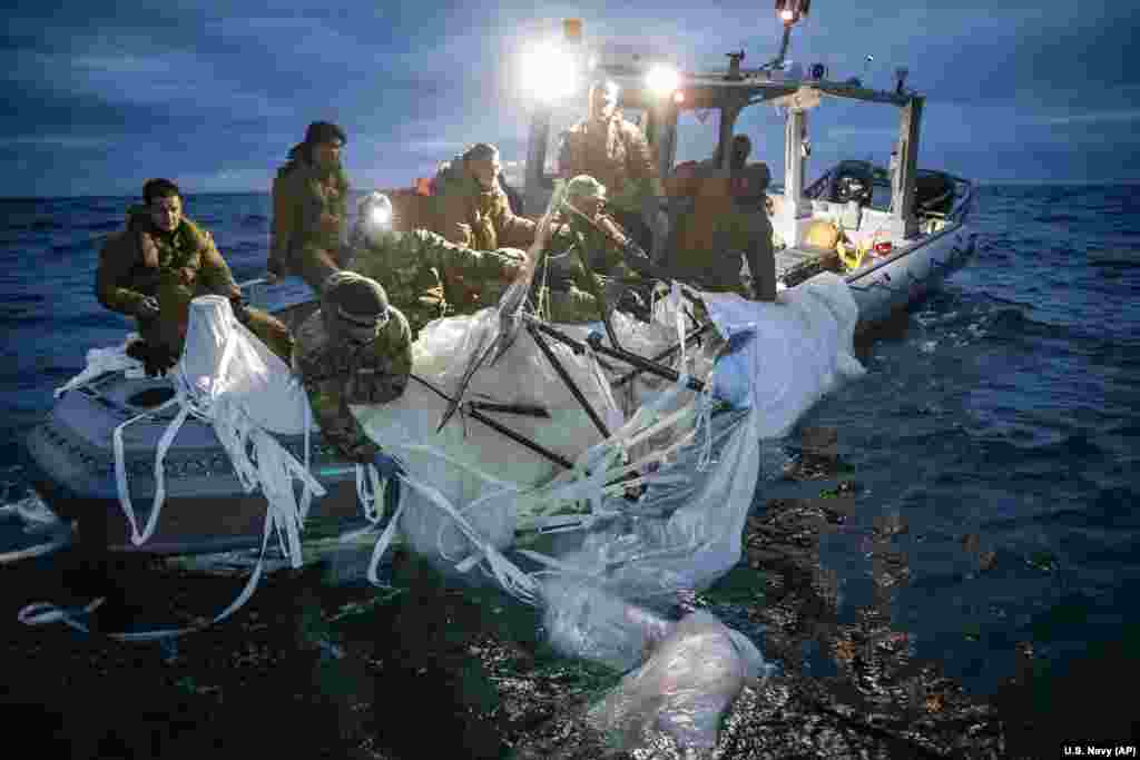 Sailors assigned to Explosive Ordnance Disposal Group 2 recover a high-altitude surveillance balloon off the coast of Myrtle Beach, South Carolina, Feb. 5, 2023.