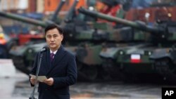 FILE - South Korea's Defense Acquisition Program Administration Minister Eom Dong-hwan attends a press conference in Gdynia, Poland, Dec. 6, 2022, as Poland welcomes the first delivery of tanks and howitzers from South Korea.
