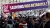 Para pengunjuk rasa memegang spanduk bertuliskan "Selamatkan pensiun kami" selama demonstrasi menentang rencana reformasi pensiun pemerintah Prancis di Paris, Selasa 31 Januari 2023.