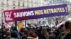 Protesters hold a banner reading "Save our pensions" during a demonstration against the French government's pension reform plan in Paris, France, Jan. 31, 2023.
