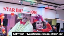 Piyapatcharee Silapee (R) and Chenvalit Silapee (L), during a dance event at the Star Dance Studio in Monterey Park, California, in 2022.